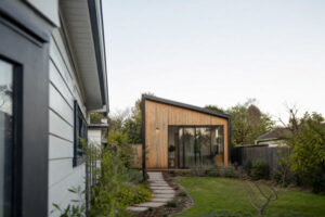 Detached timber cabin in the backyard of an existing residential home