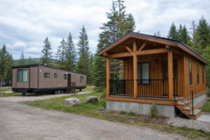 Park model on a chassis compared with a prefab timber cabin on a concrete foundation